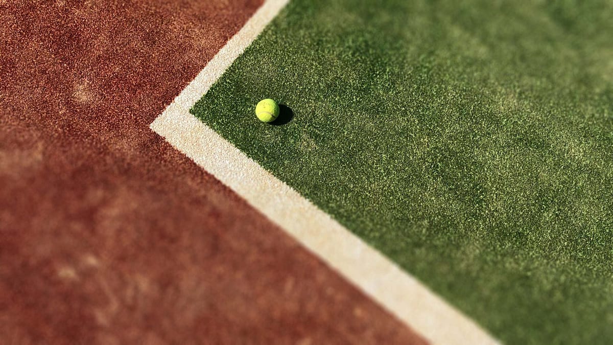 Matt Gough @ Lancashire Insurance image of a ternnis ball on a tennis court