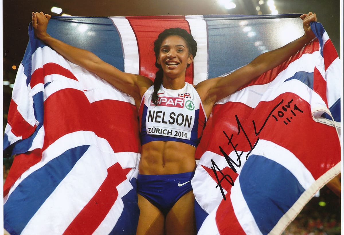 Science to Slam. Image of Ashleigh Nelson in athletic kit holding union jack flag